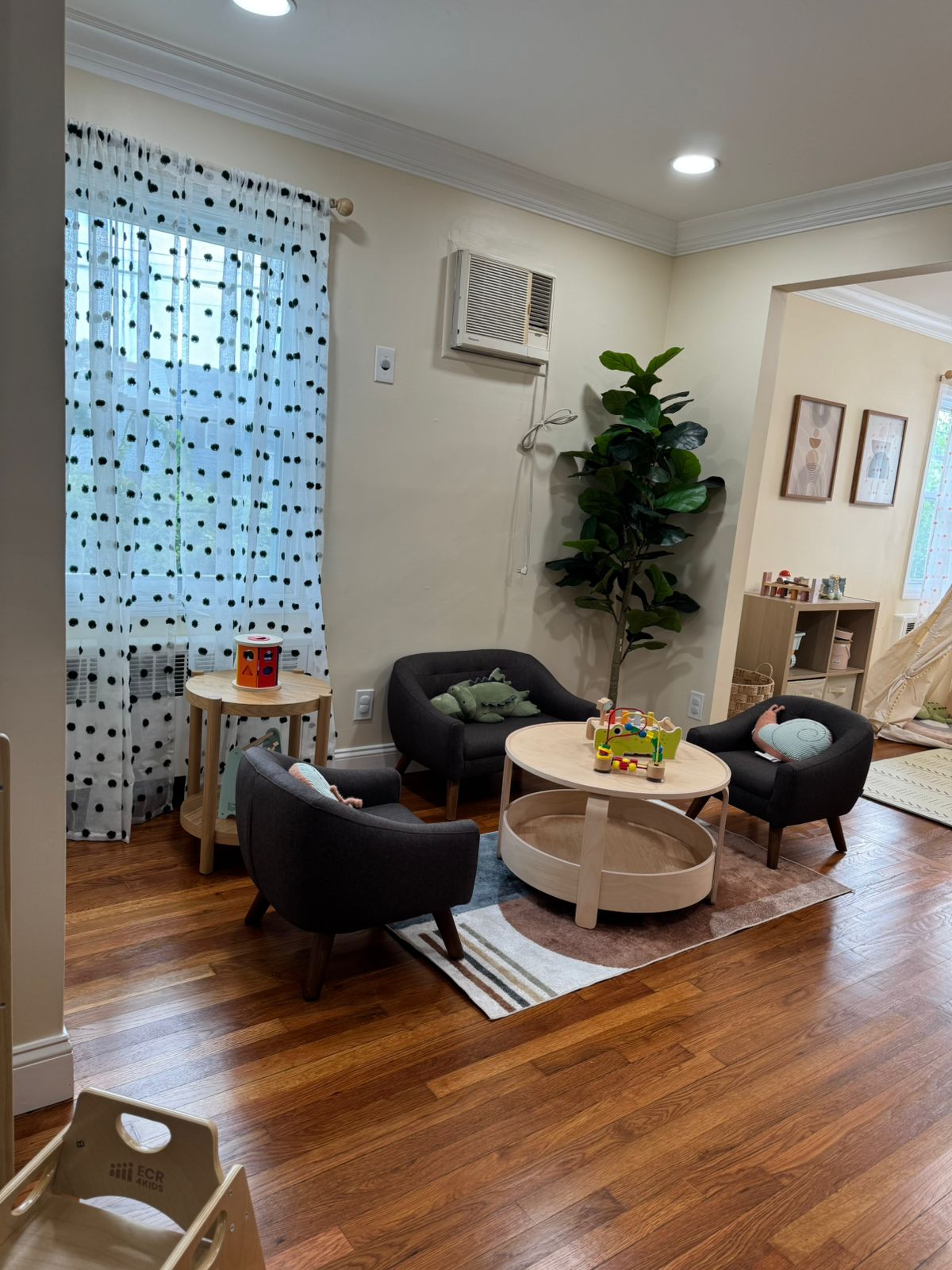 Comfortable parent seating area with modern furniture